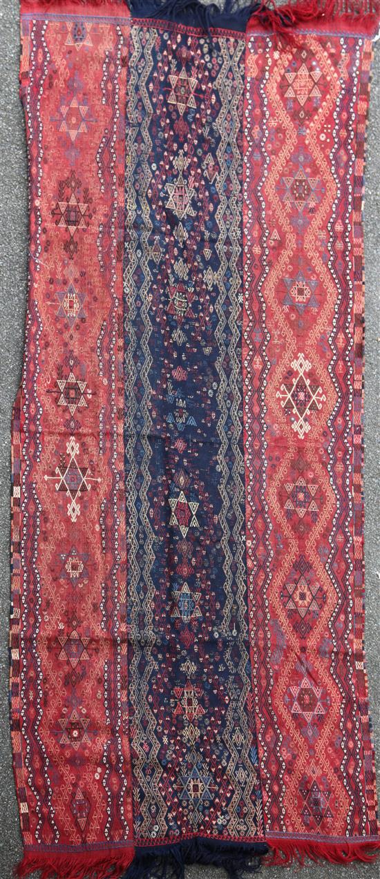 A Kelim wall hanging/rug, 9ft 7in by 4ft 2in.